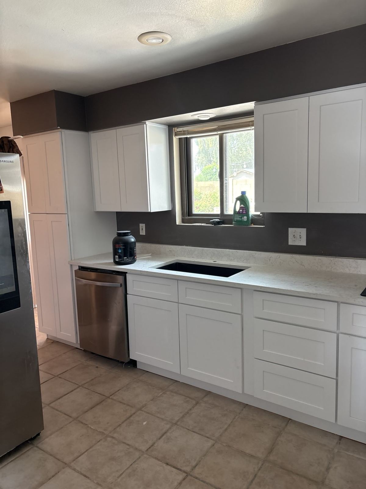 Finished white kitchen wall with new cooktop in Phoenix